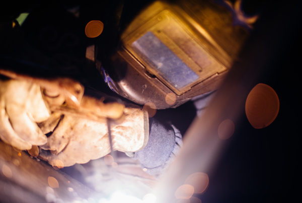 millwright welding with protective equipment