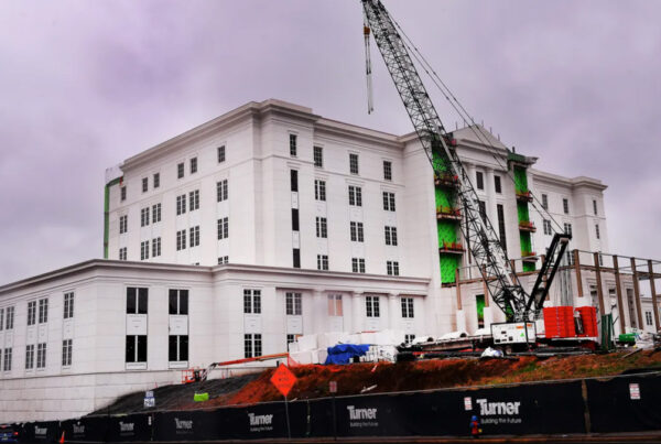crane lifts final steel beam above spartanburg courthouse
