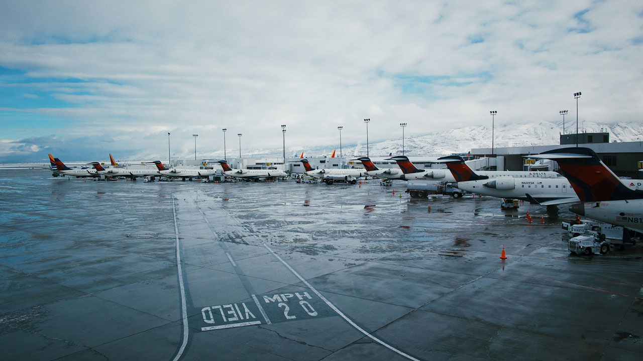 airplanes parked at terminal