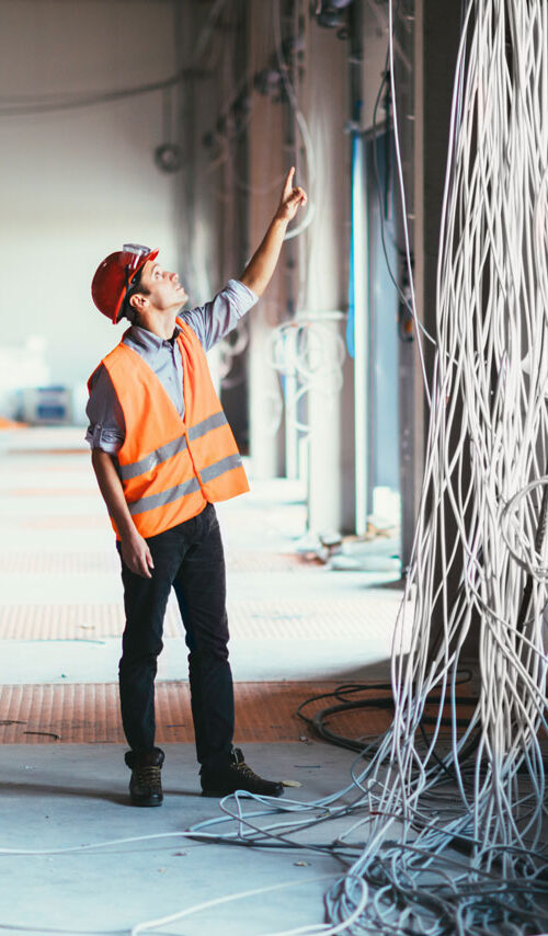 mechanical contractors inspecting data center cables