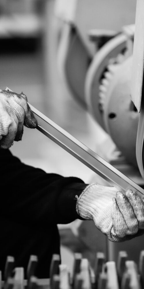 Industrial millwright performing emergency equipment repair and maintenance services in manufacturing facility