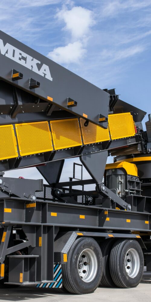 Heavy industrial equipment being transported on specialized trailer during plant relocation project